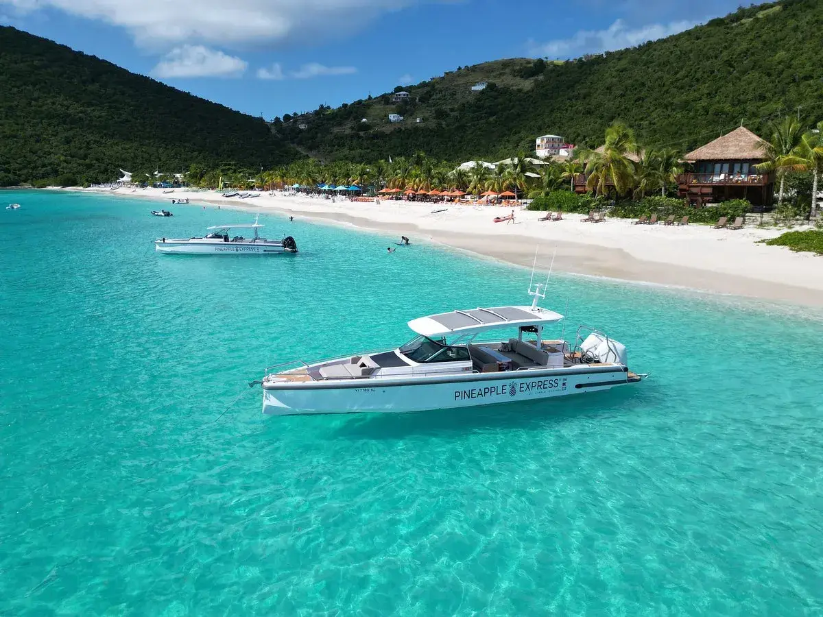 Pineapple Express charter boat in turquoise Caribbean water at Jost Van Dyke — Cruz Bay Watersports