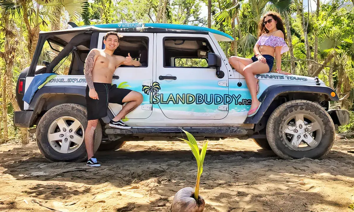 Island Buddy 2022 Bronco parked on a St. Thomas mountain overlook with turquoise bay below