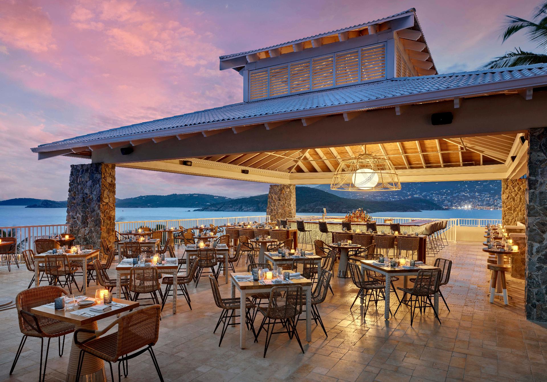 Outdoor Caribbean dining with ocean views and tropical cocktails on St. Thomas