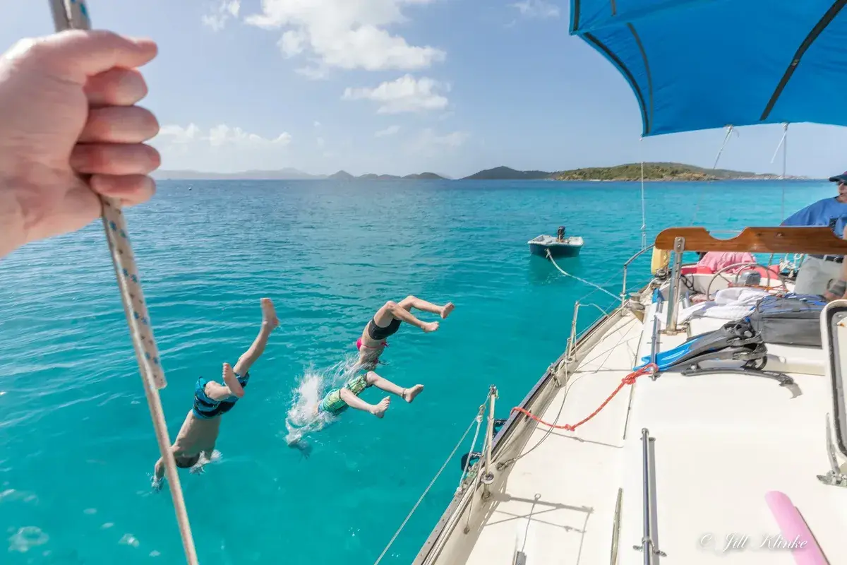 Sailing yacht anchored in a secluded cove in the US Virgin Islands during a multi-day term charter from St. Thomas