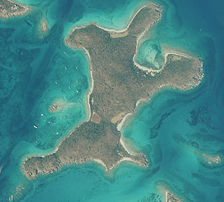 Aerial view of Christmas Cove island surrounded by turquoise Caribbean waters near St. Thomas