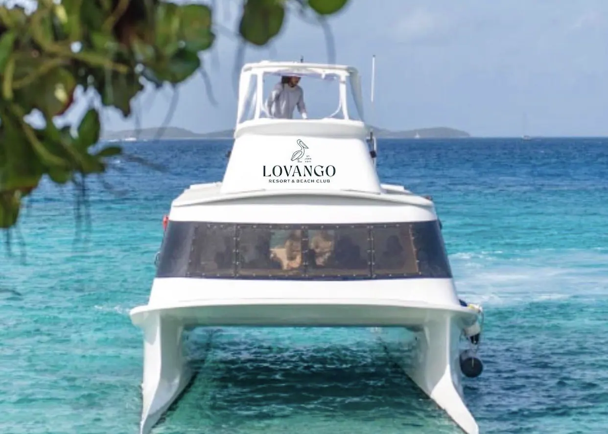 Lovango Resort and Beach Club ferry boat cruising through turquoise Caribbean waters