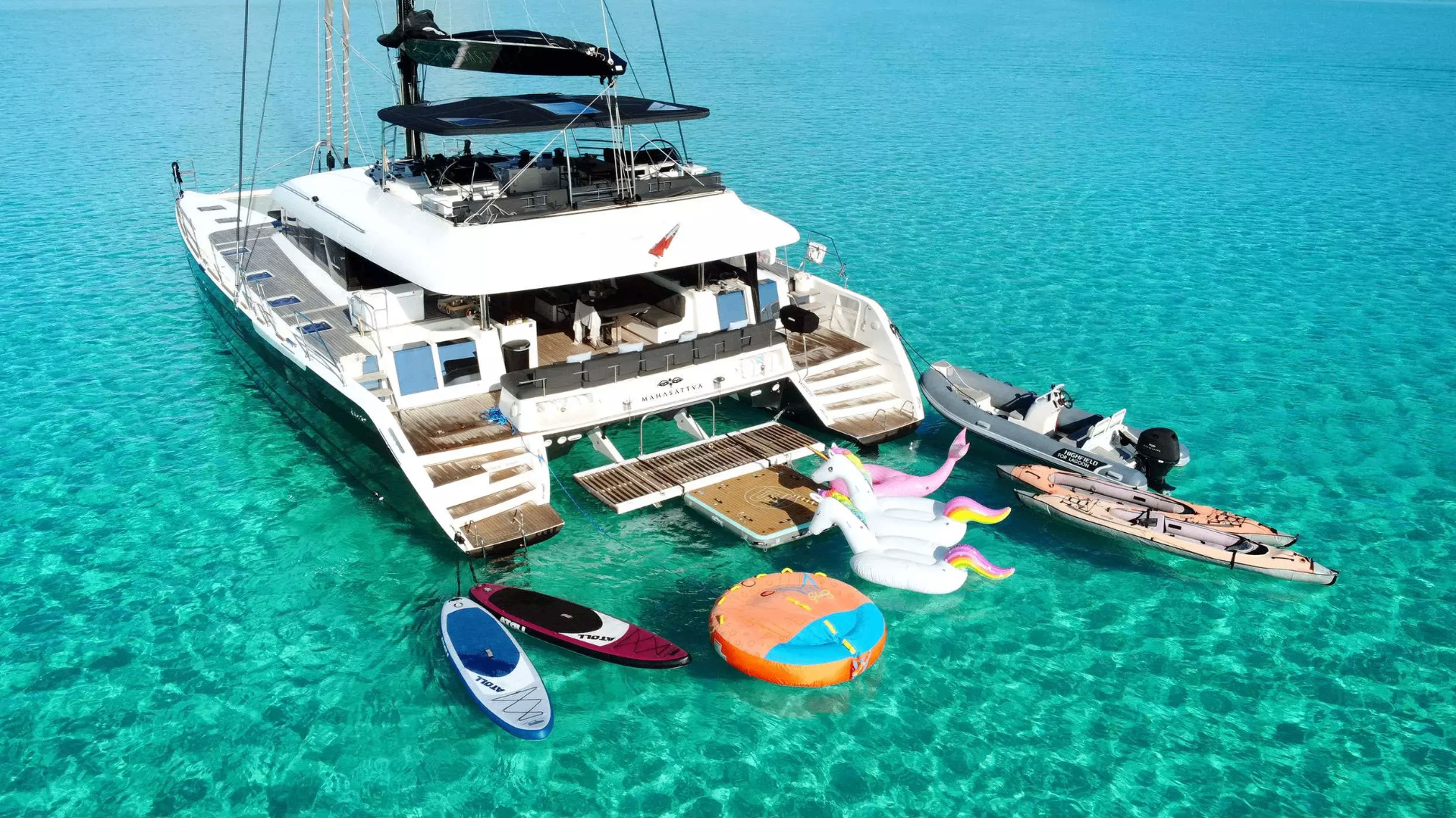Luxury catamaran anchored in clear turquoise water near St. Thomas