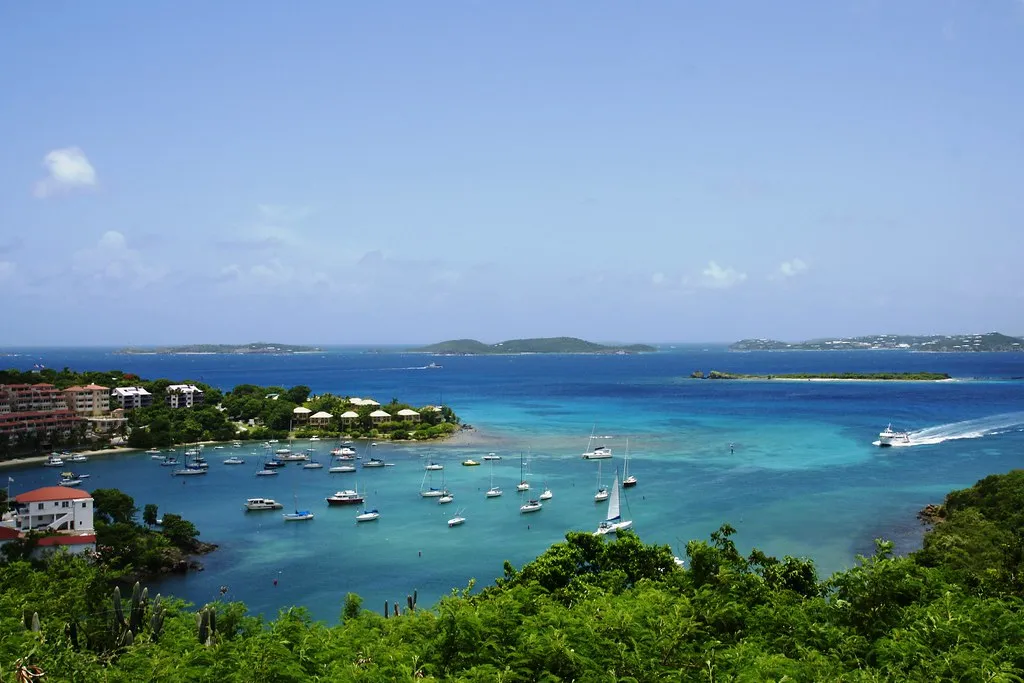 Aerial view of a Virgin Islands harbor with boats moored in clear blue water