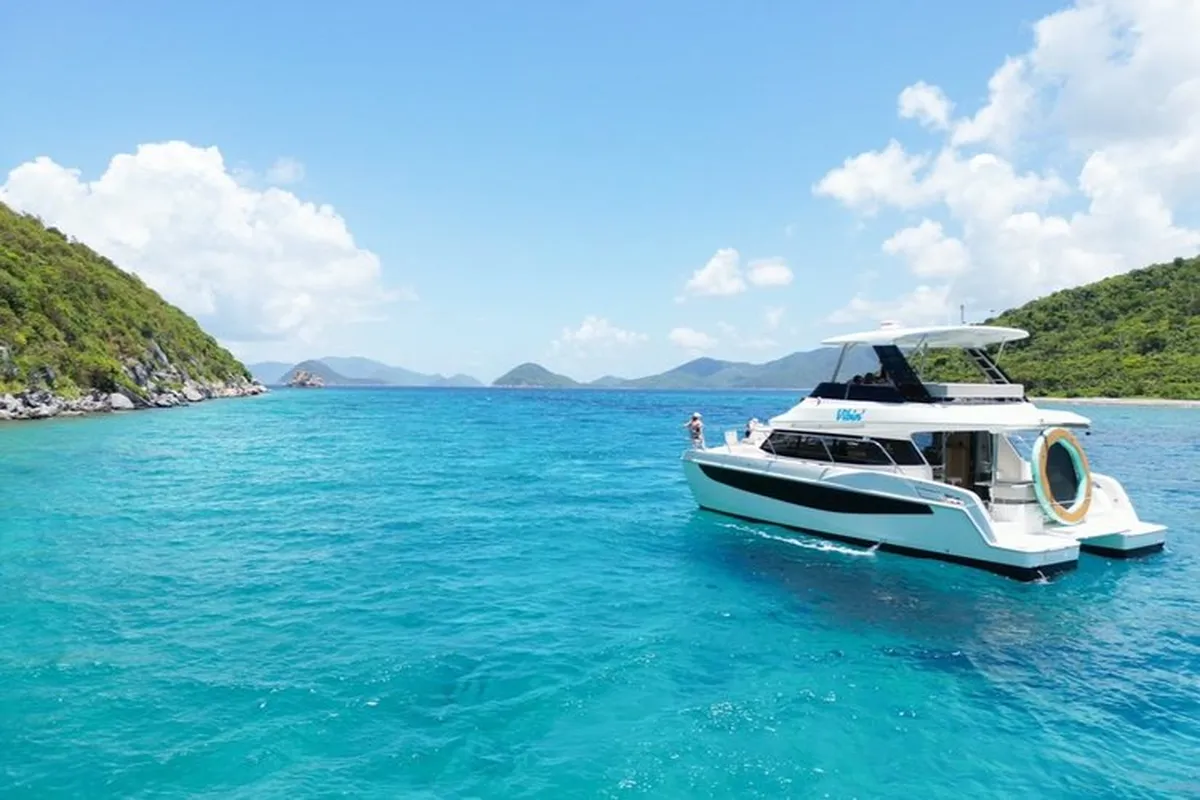 Private power catamaran anchored in crystal clear turquoise waters near St. Thomas, US Virgin Islands