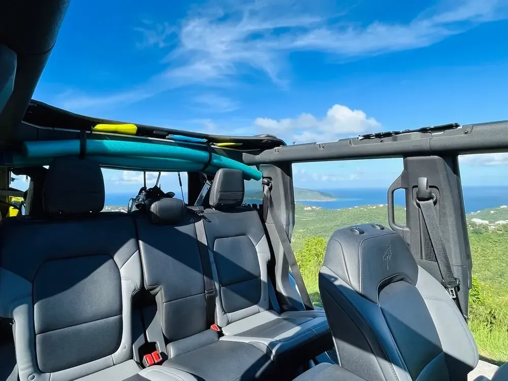 Open-air Jeep tour with paddleboards overlooking turquoise Caribbean waters on St. Thomas, US Virgin Islands
